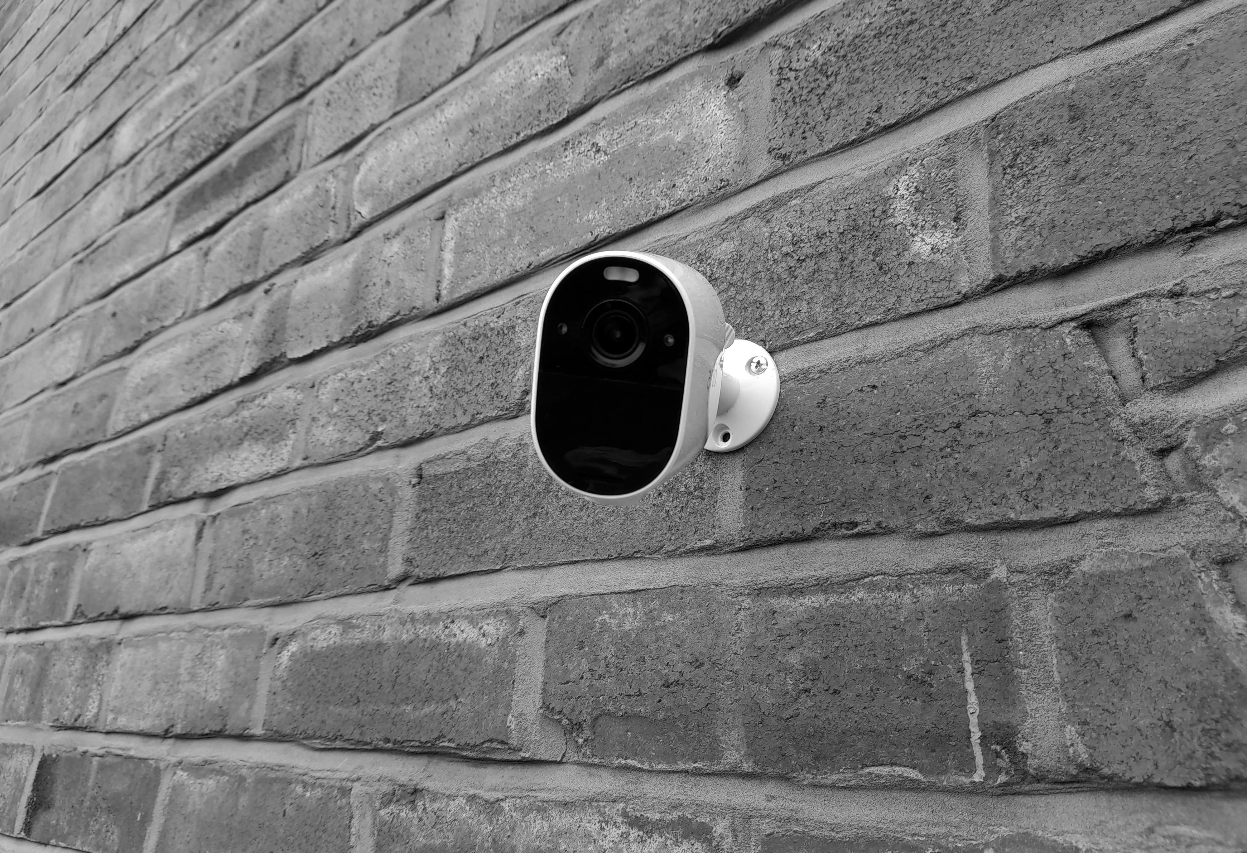 Security camera on brick wall